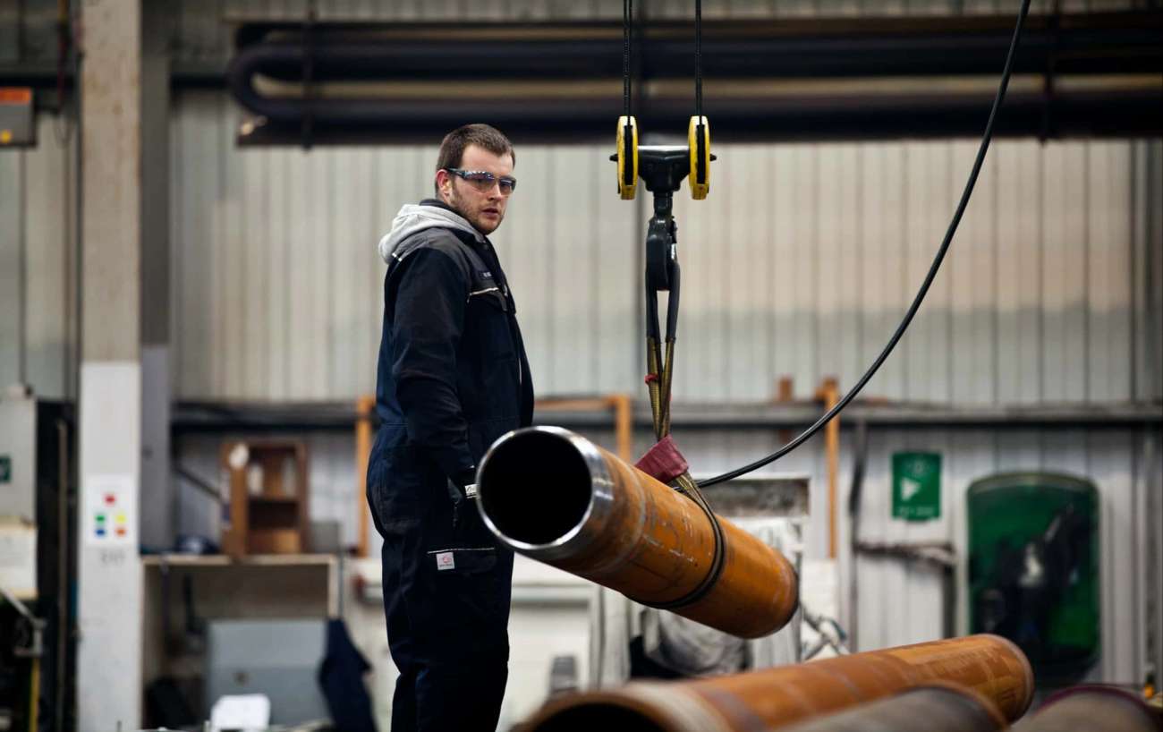 Person looking at tube hanging on rope