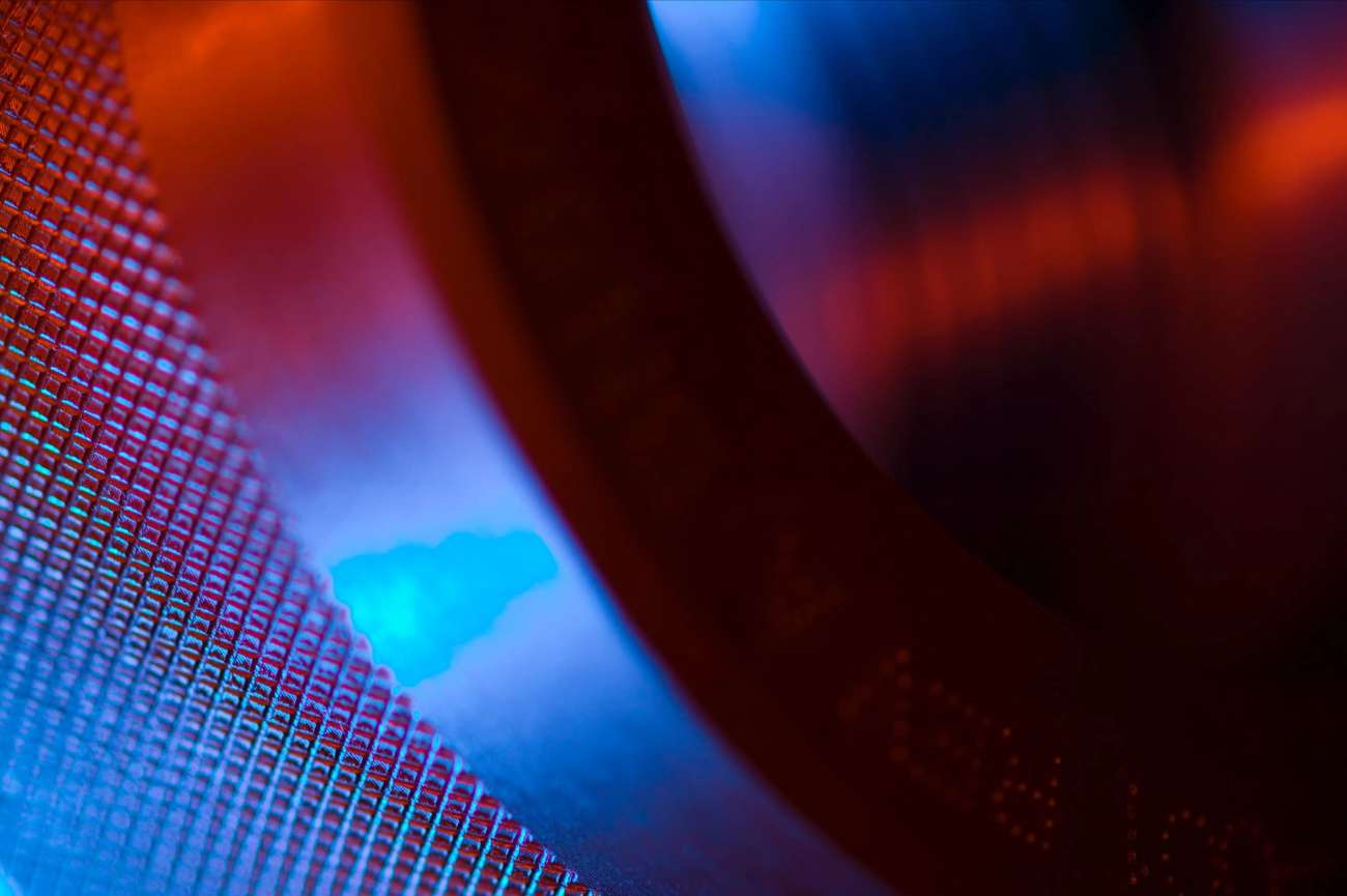Closeup of a metal tool with red and blue lighting