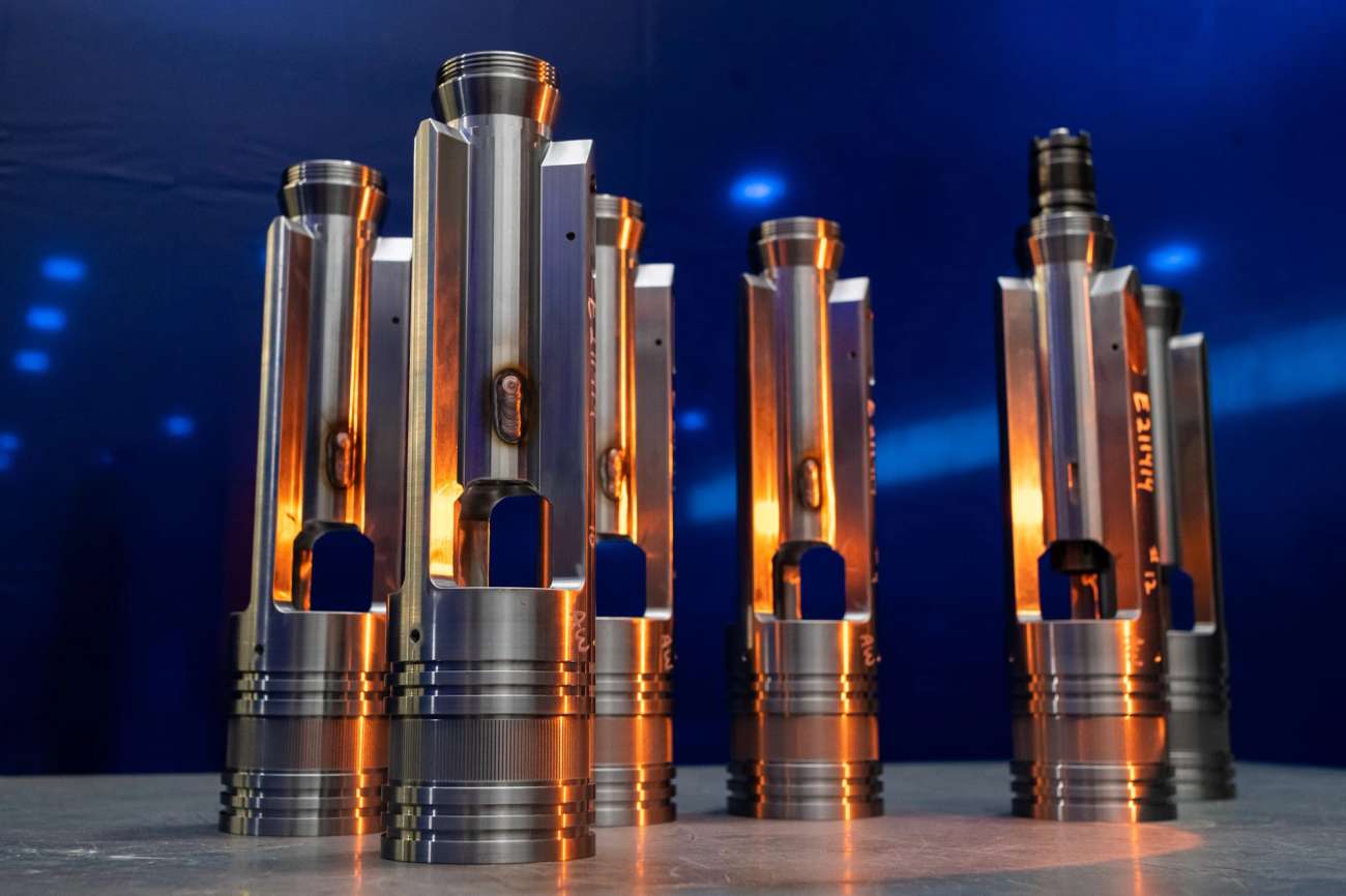 Multiple metal tools standing on table with blue background and orange light