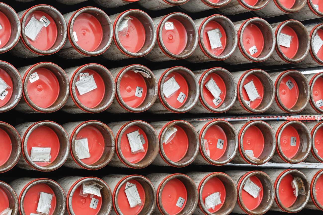 Stacked pipes with red caps