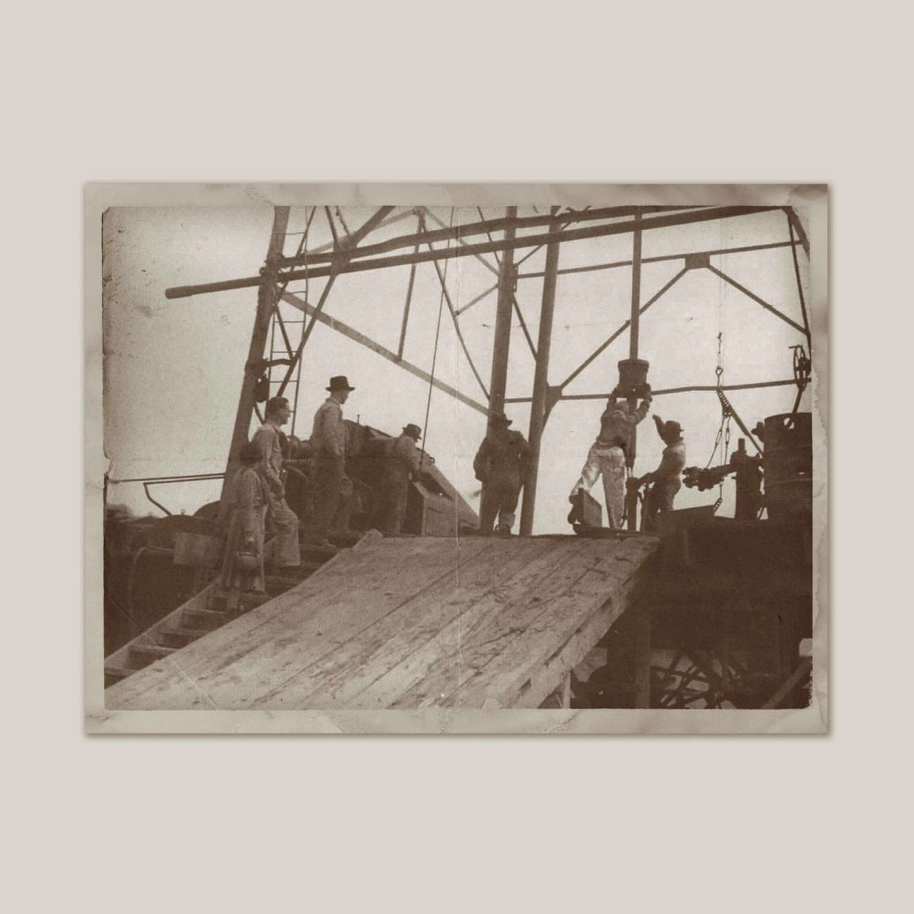 Old black and white photo of Hunting family members on a land-based oil rig in Mexico