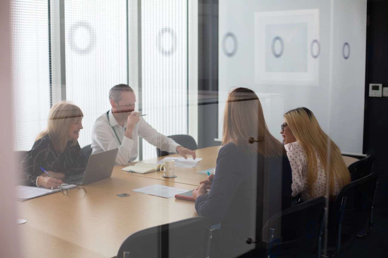 Group of people sitting in an office