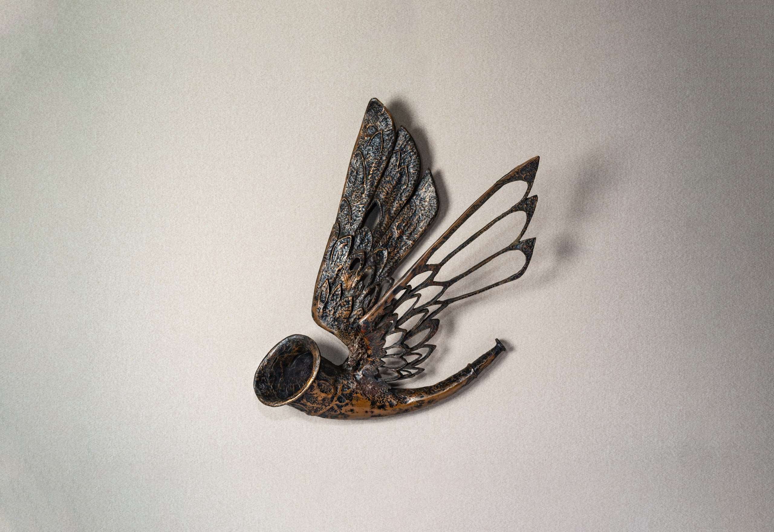 The Hunting horn in brass on a wall